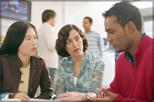 Three people having a discussion.